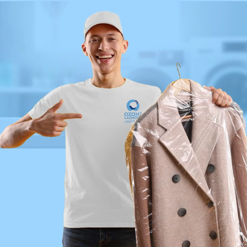 a man holding a coat in a plastic bag